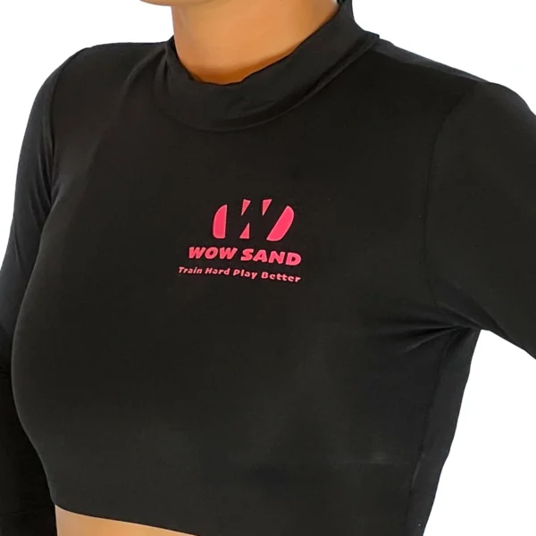 WOW Sand’s black long sleeve crop top for comfortable sand volleyball play.