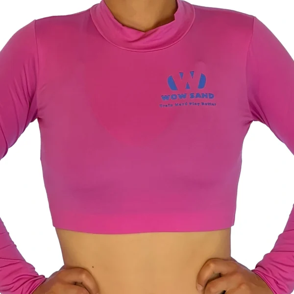 WOW Sand’s pink long sleeve crop top for comfortable sand volleyball play.