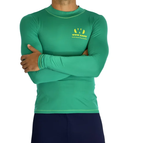 Close-up of a WOW Sand Emerald Long Sleeve t-shirt showcasing the brand logo