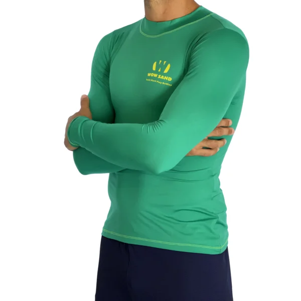 Close-up of a WOW Sand Emerald Long Sleeve t-shirt showcasing the brand logo