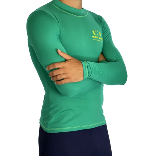 Close-up of a WOW Sand Emerald Long Sleeve t-shirt showcasing the brand logo