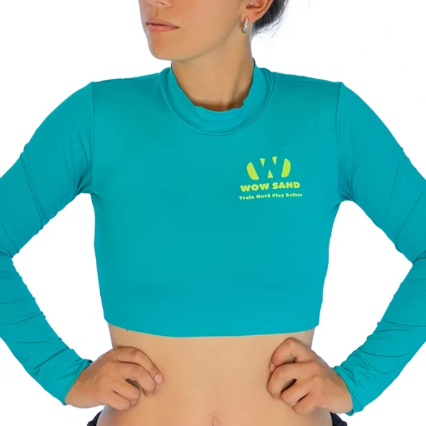 Iris blue crop top with long sleeves by WOW Sand, ideal for sand volleyball and outdoor sports.